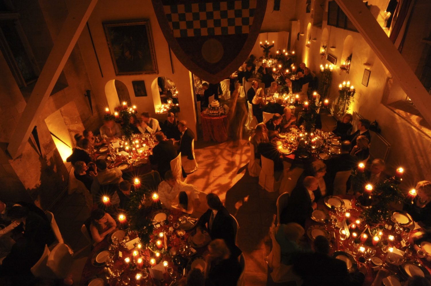 A low light shot from above of the hall filled with dining guest