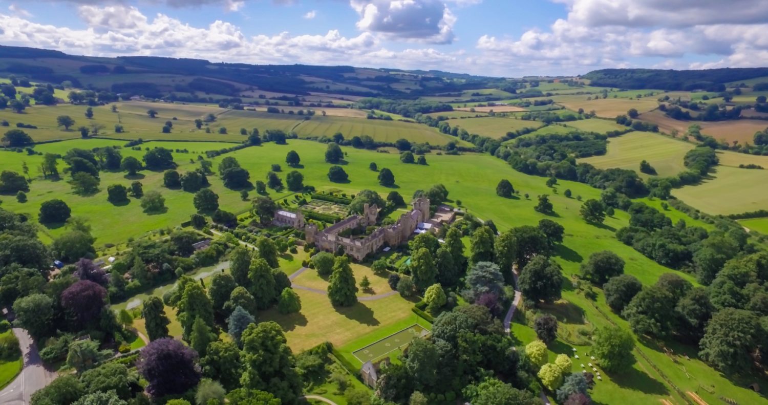 High aerial shot of the castle and it's grounds