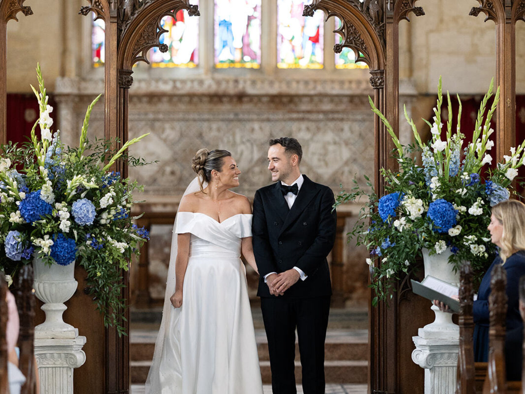 Chapel beautifully adorned with florals and newlyweds.