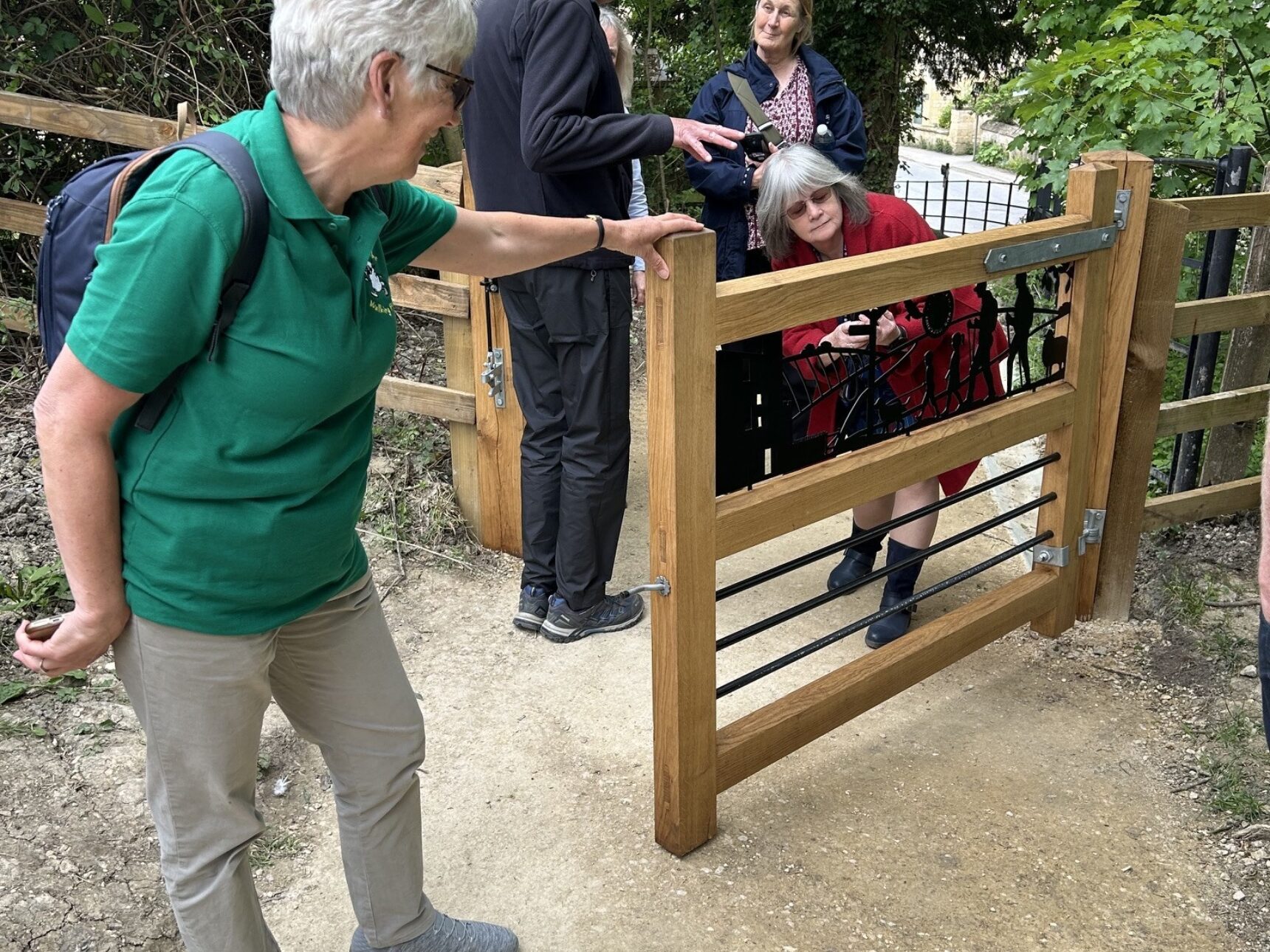 Walkers admire the footpath gate