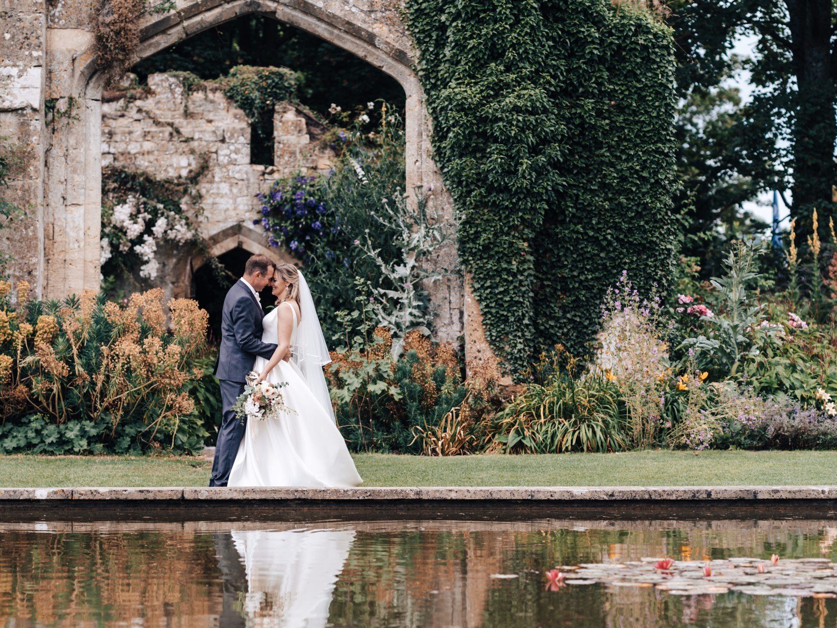 Wedding Couple in front of Tithe Barn