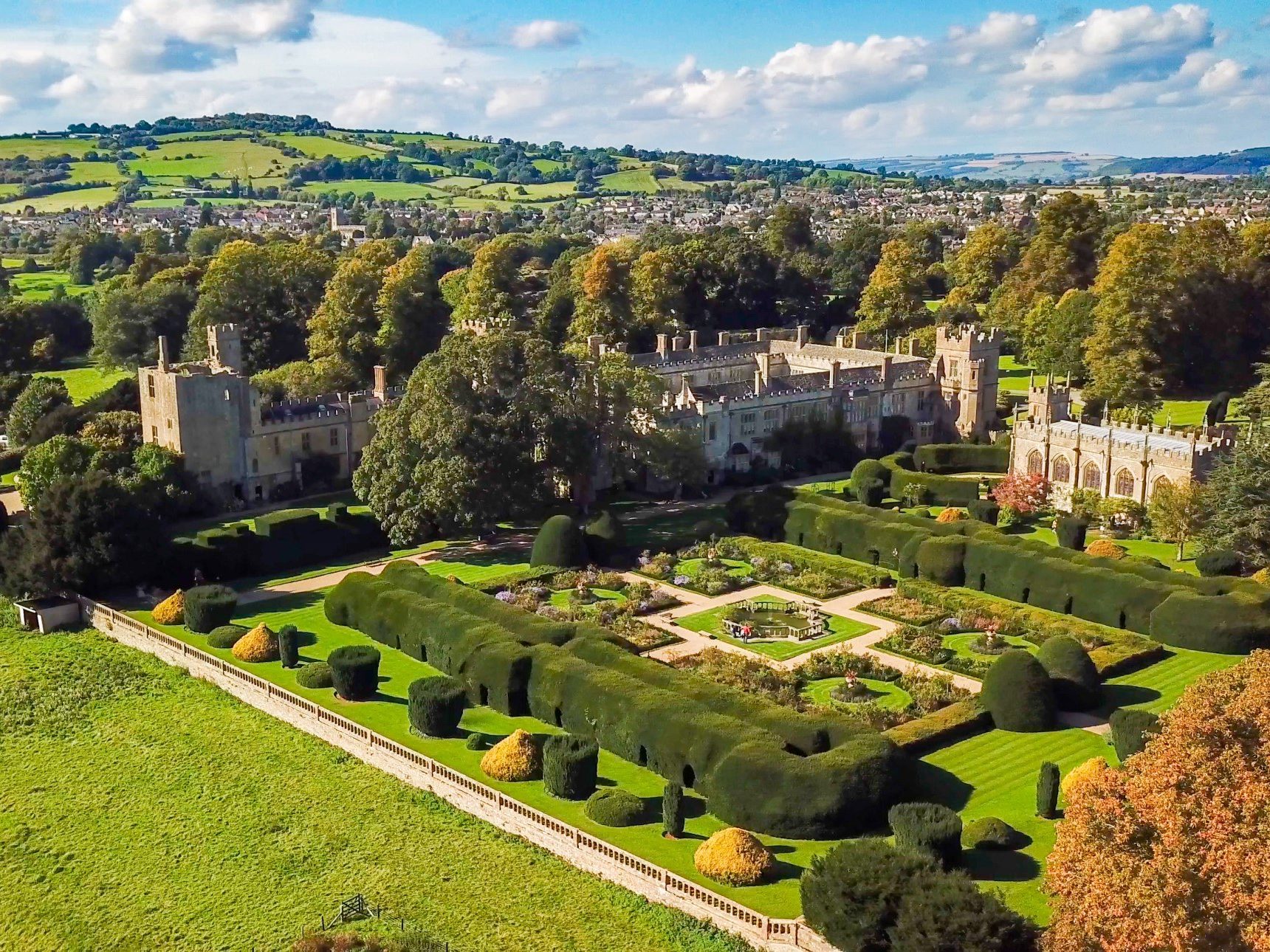 aerial view of suceley castle, gardens and wider estate